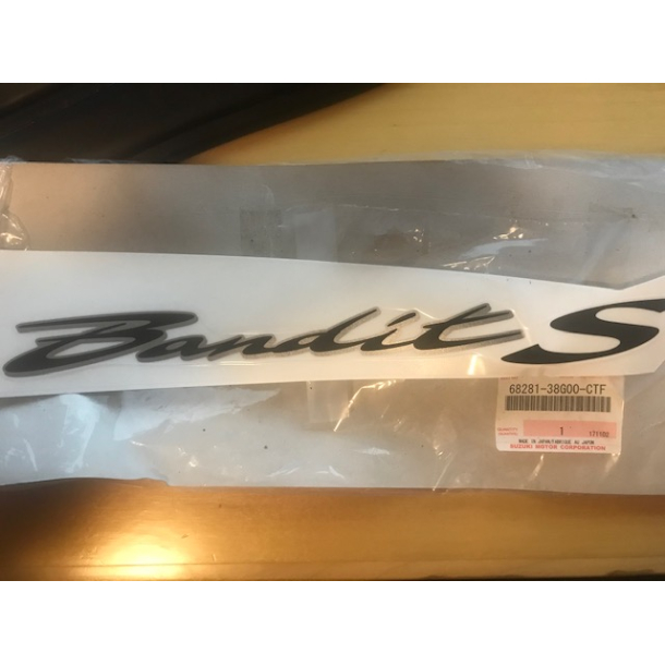SUZUKI 6828138G00CTF 68281-38G00-CTF EMBLEM,COWLING BODY SIDE,L 2006 GSF650(N)(S)(NA)(SA) BANDIT